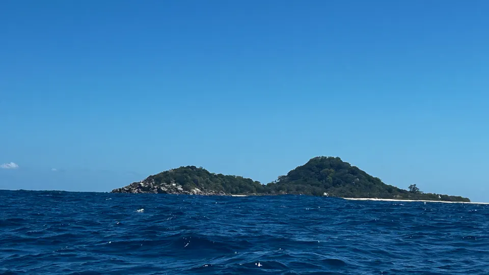 The wake of the twin engines crossing open water